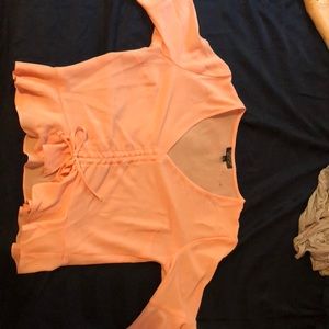 Light pink ruffle front tie blouse